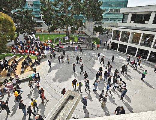 students walking across Malcolm X Plaza 